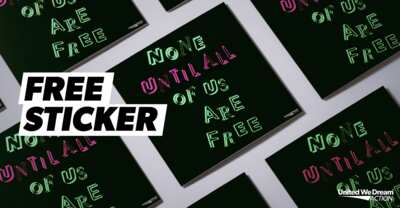 Speak Truth with a Sticker – Free ‘None Until All Are Free’